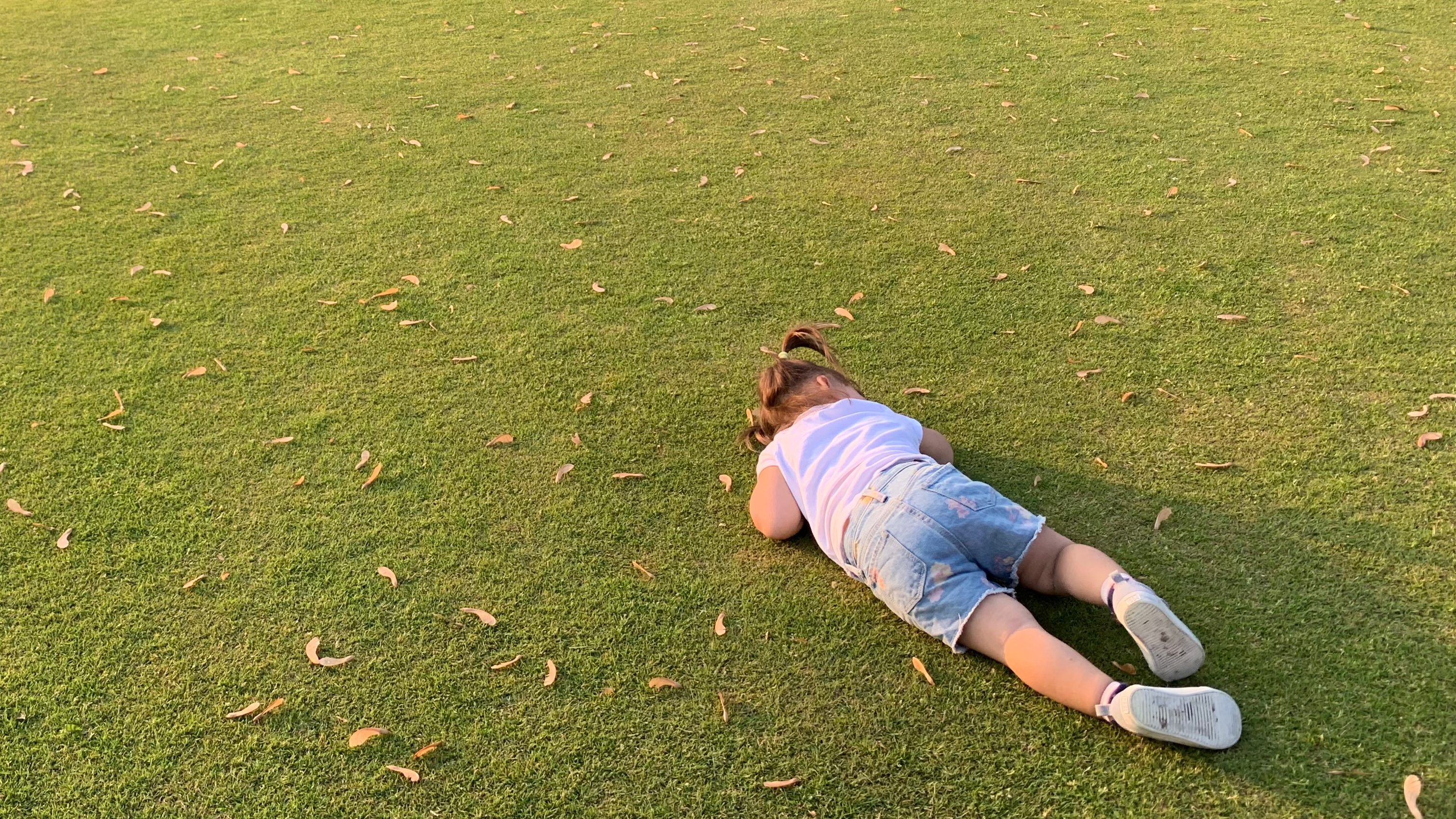 child napping on the West Toronto Lawn Bowling Club green